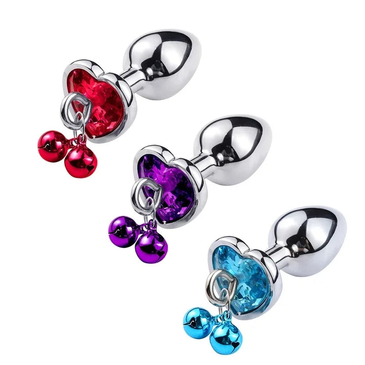 GHALLAS bondage stimulation set of three metal plugs with red purple and blue heart-shaped gems and dangling beads