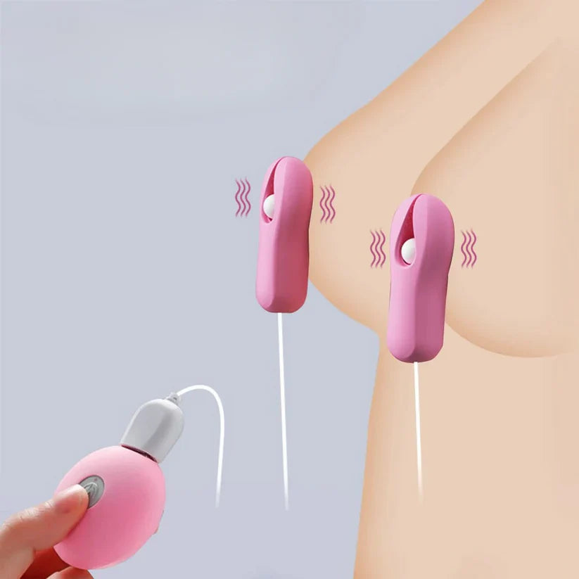 Pink electric nipple clamp vibrator being used on a person's nipples with remote control