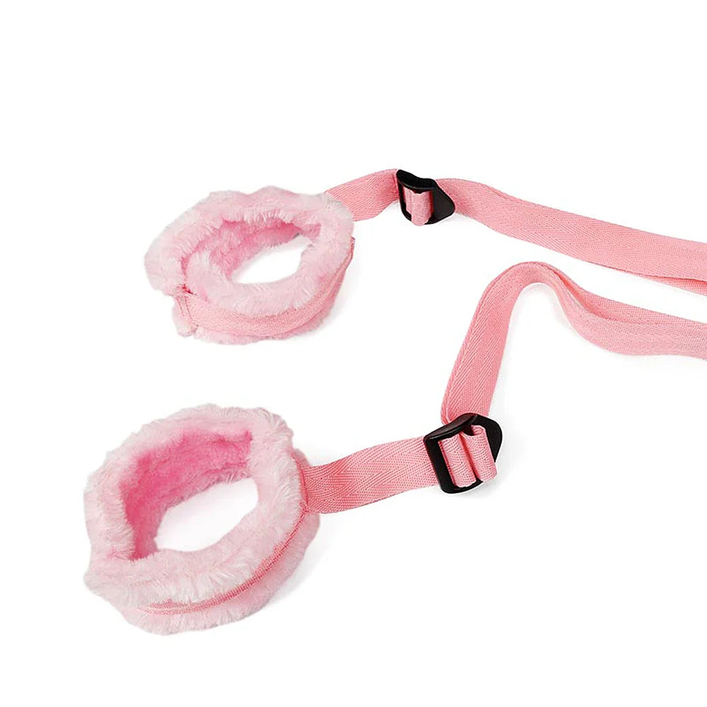 Pink intimate restraint set for couples with adjustable soft furry cuffs and straps