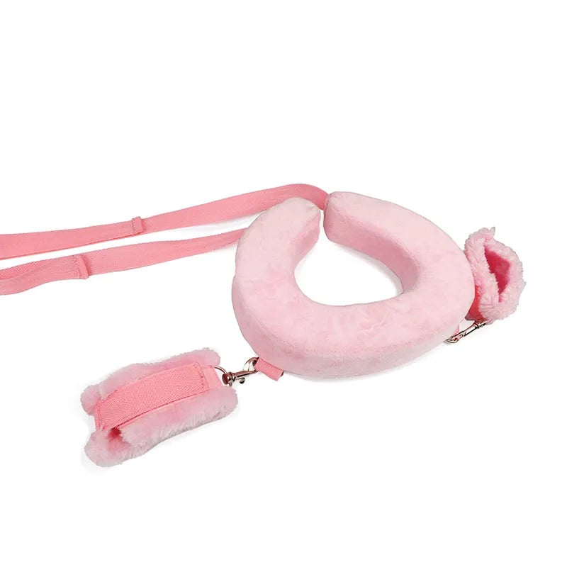 Soft pink intimate restraint set for couples featuring adjustable straps and plush cuffs