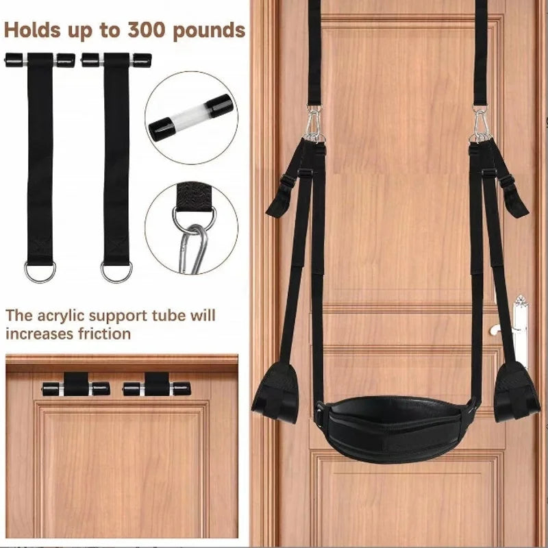 Pleasure swing for couples by Gothic Tot with black straps and padded seat hanging on a wooden door