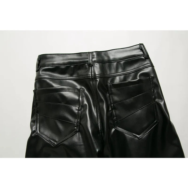Back view of black leather zipper pants with rear pockets and belt loops by Ghallas